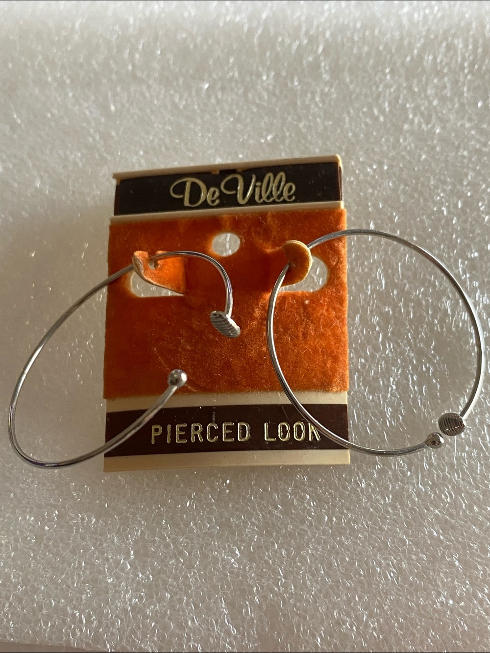 DeVille Silver Tone Hoop Earrings  Pierced Look- Orange Cardback